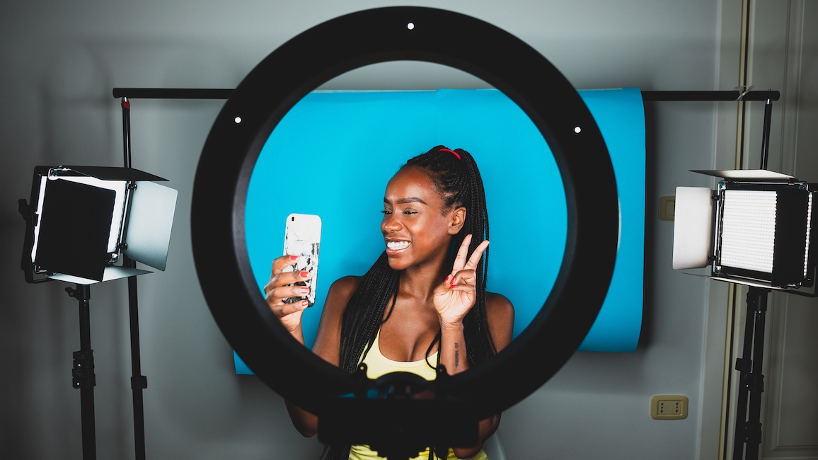 Creator filming with ring light